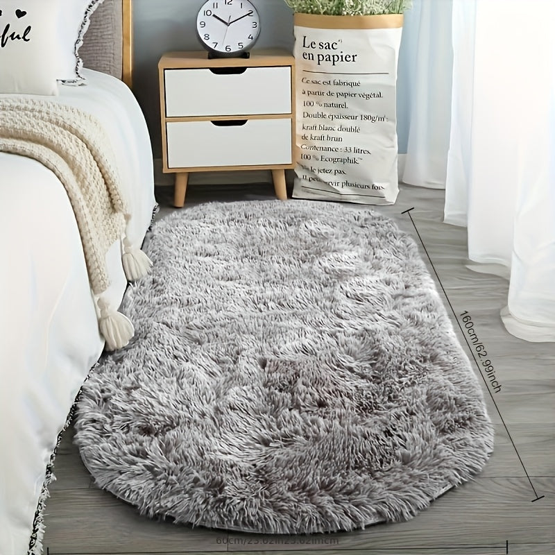 Soft faux fur oval area mat that is luxurious, plush, non-slip, hand washable, and durable. Perfect for adding a touch of elegance to your bedroom, living room, or home decor. Available in two sizes.