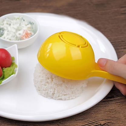 Large yellow plastic rice ball mold with easy-release feature, non-stick half-sphere design, and built-in strainer for kids' meals.