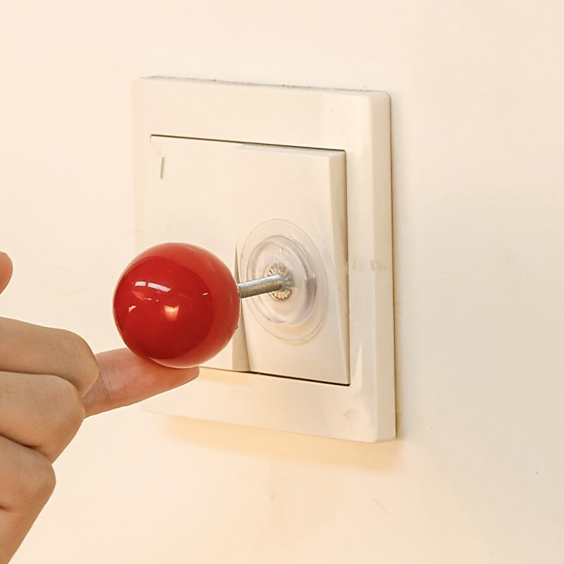 Modern lever ball switch sticker for light switch, drawer handle, toilet pusher - no battery needed, easy stick-on design.