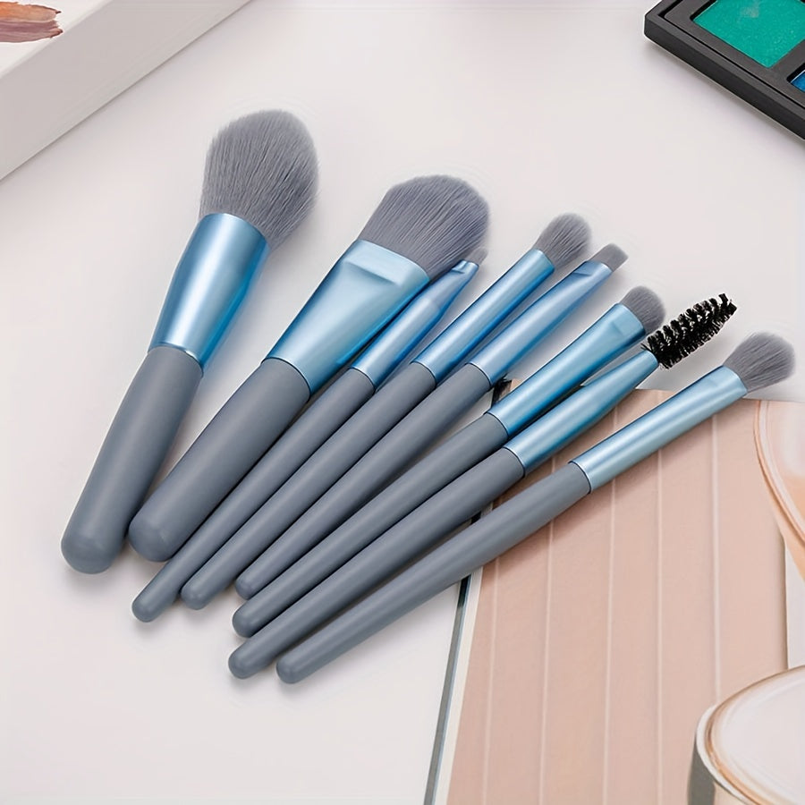 8 soft, portable facial makeup brushes in blue for entry-level beauty tools. Includes eyeshadow, nose shadow, blush, lip brush, eyelash comb, and travel powder brush. Ideal gift for beauty