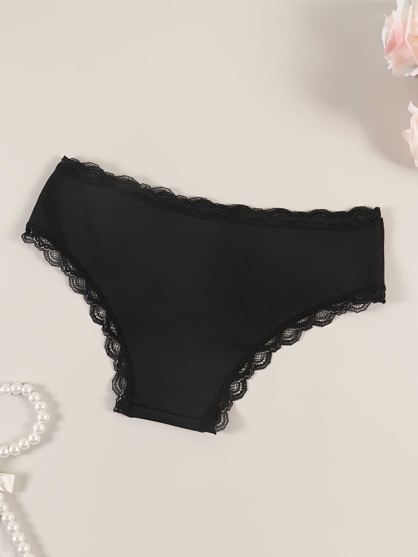 Sexy lace women's panties with delicate lace trim, comfortable and breathable nylon/elastane blend, non-see-through, hand washable in black.