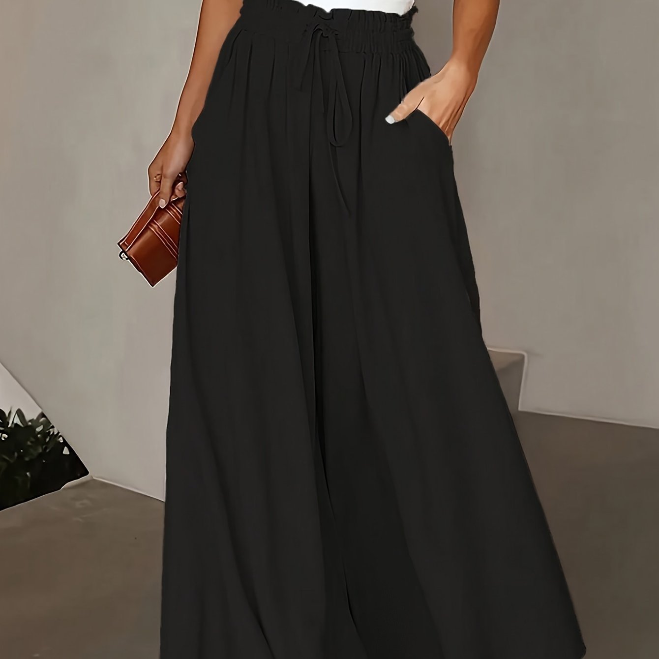 Wide leg flowy pants in a solid color, perfect for spring and summer. Casual high waist design, versatile for women's clothing.