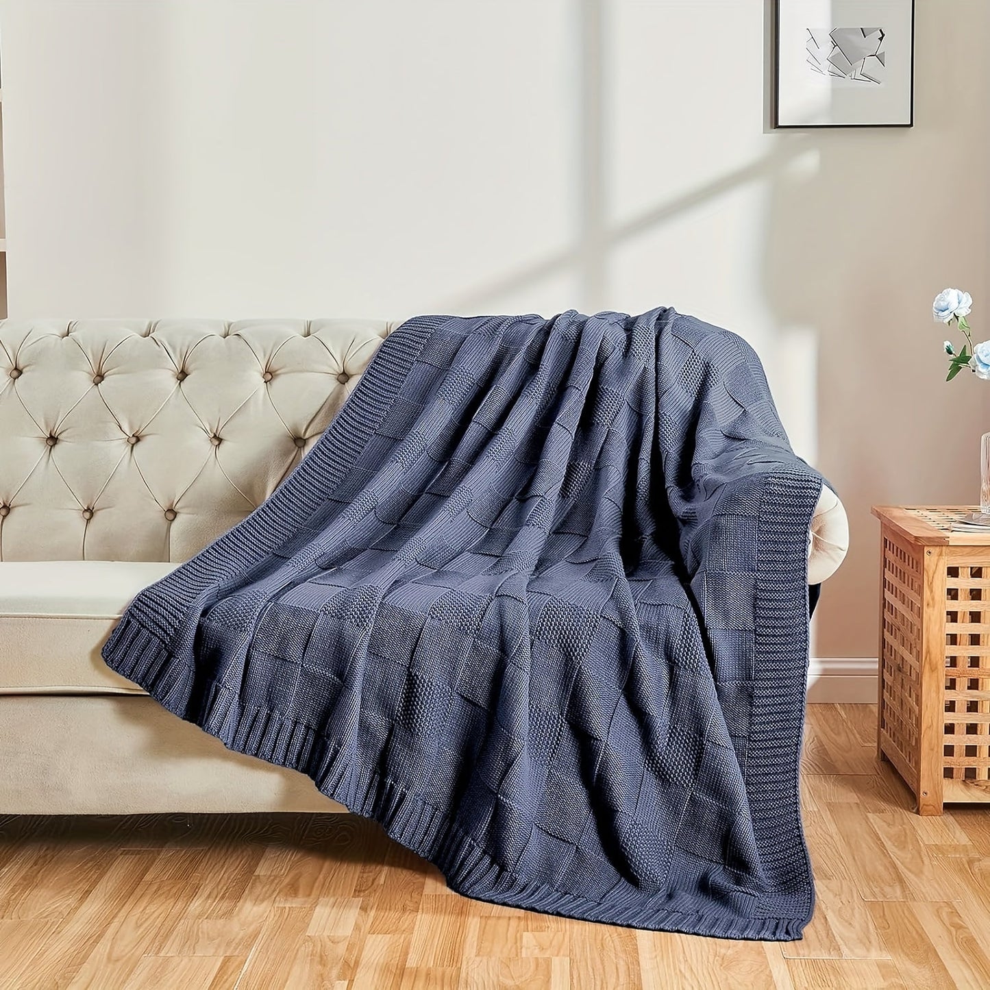 Soft and cozy knit throw blanket in white checkered pattern, perfect for couch or bed. Keep warm and stylish in any room with this knitted throw blanket.