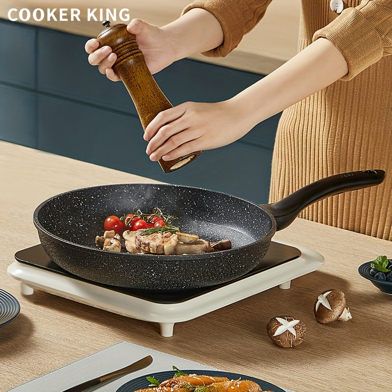 Choose from four different sizes of the COOKER KING Nonstick Frying Pan, all with a heat-resistant handle and PFOA-free coating. This pan is induction ready and compatible with all cooktops. Sizes available include 24.0cm, 25.4cm, 27.94cm, and 29.97cm.