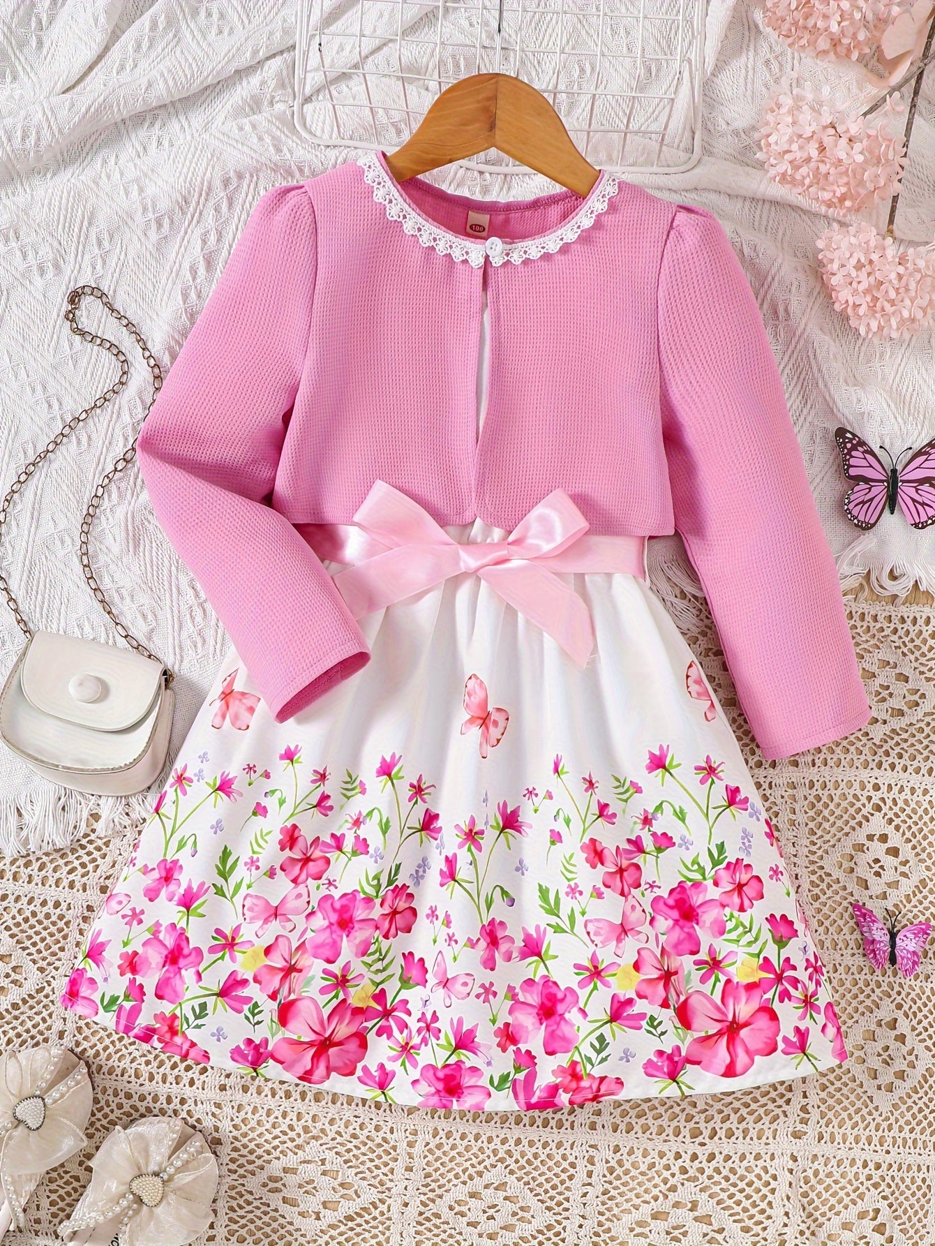 Girls' spring fashion 2-piece set includes floral print dress with belt detail and matching cardigan. Made of 100% polyester, non-stretch woven fabric. Perfect for outdoor wear.