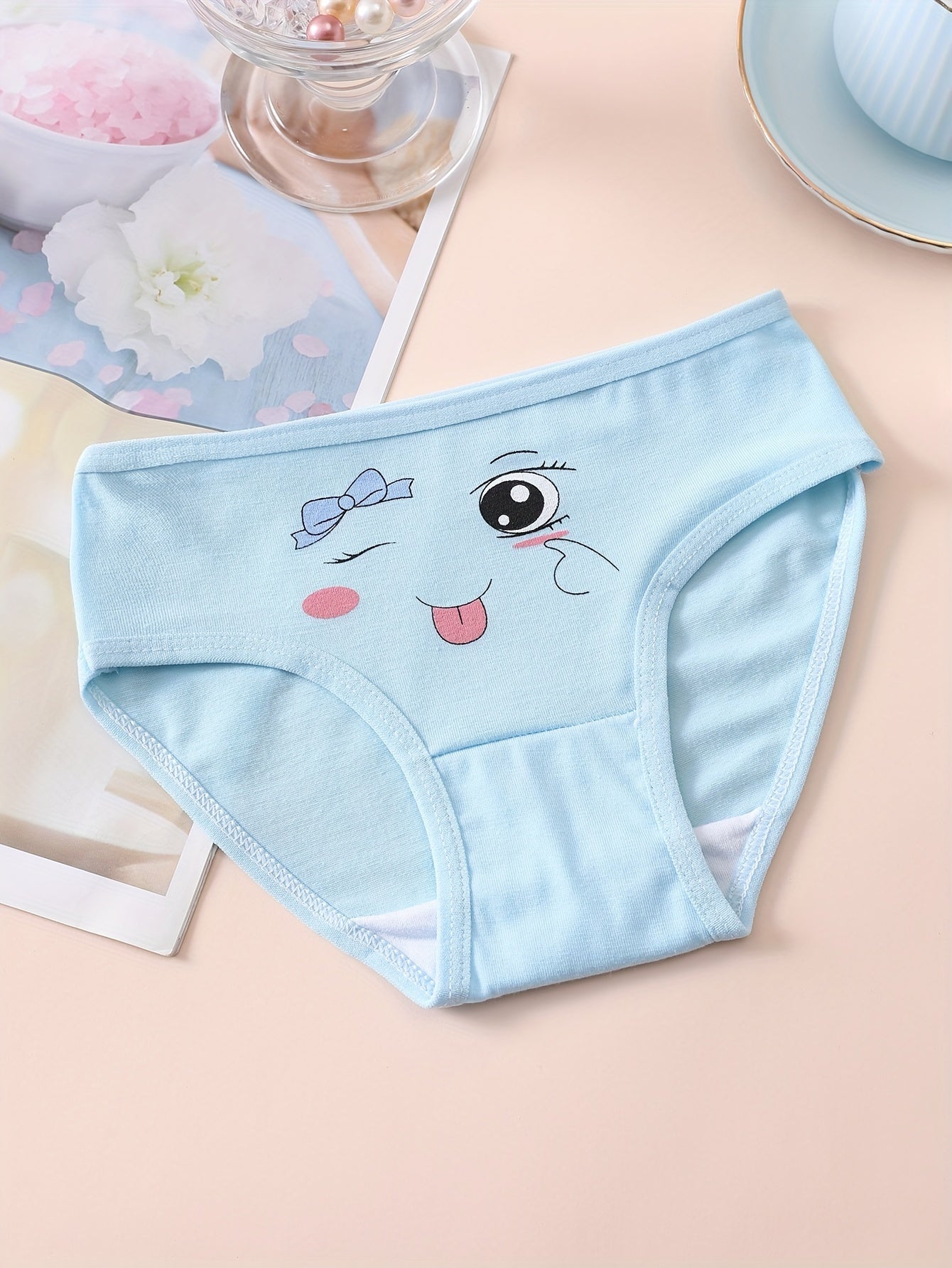 10 pieces of girls' soft and comfortable cotton briefs with cute patterns and breathable fabric.