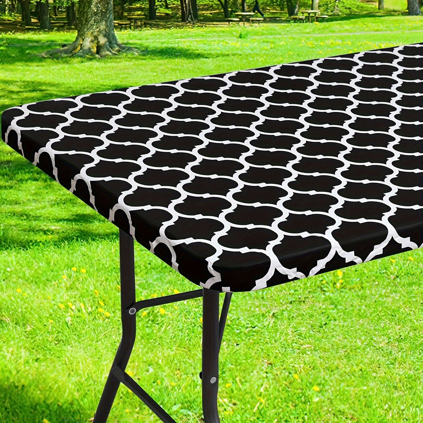 Waterproof vinyl table cover with flannel backing and elastic edge, featuring a gray and white geometric pattern. Ideal for indoor and outdoor use on home patio. Machine-woven fabric with easy-clean surface.