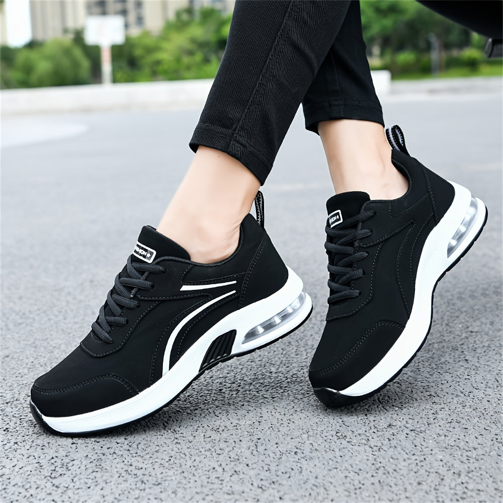 Women's casual sneakers made from black synthetic leather, featuring a lightweight design, air cushion support, lace-up style suitable for work, travel, or sports. Stylish and breathable