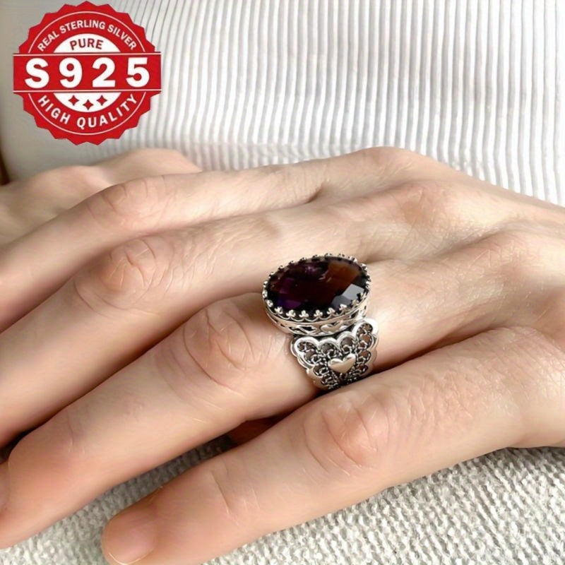 Handmade with care, this stunning cocktail ring features a detailed filigree art heart design and is crafted from 925 sterling silver. Adorned with a beautiful amethyst gemstone, this solid silver ring is perfect for everyday wear.