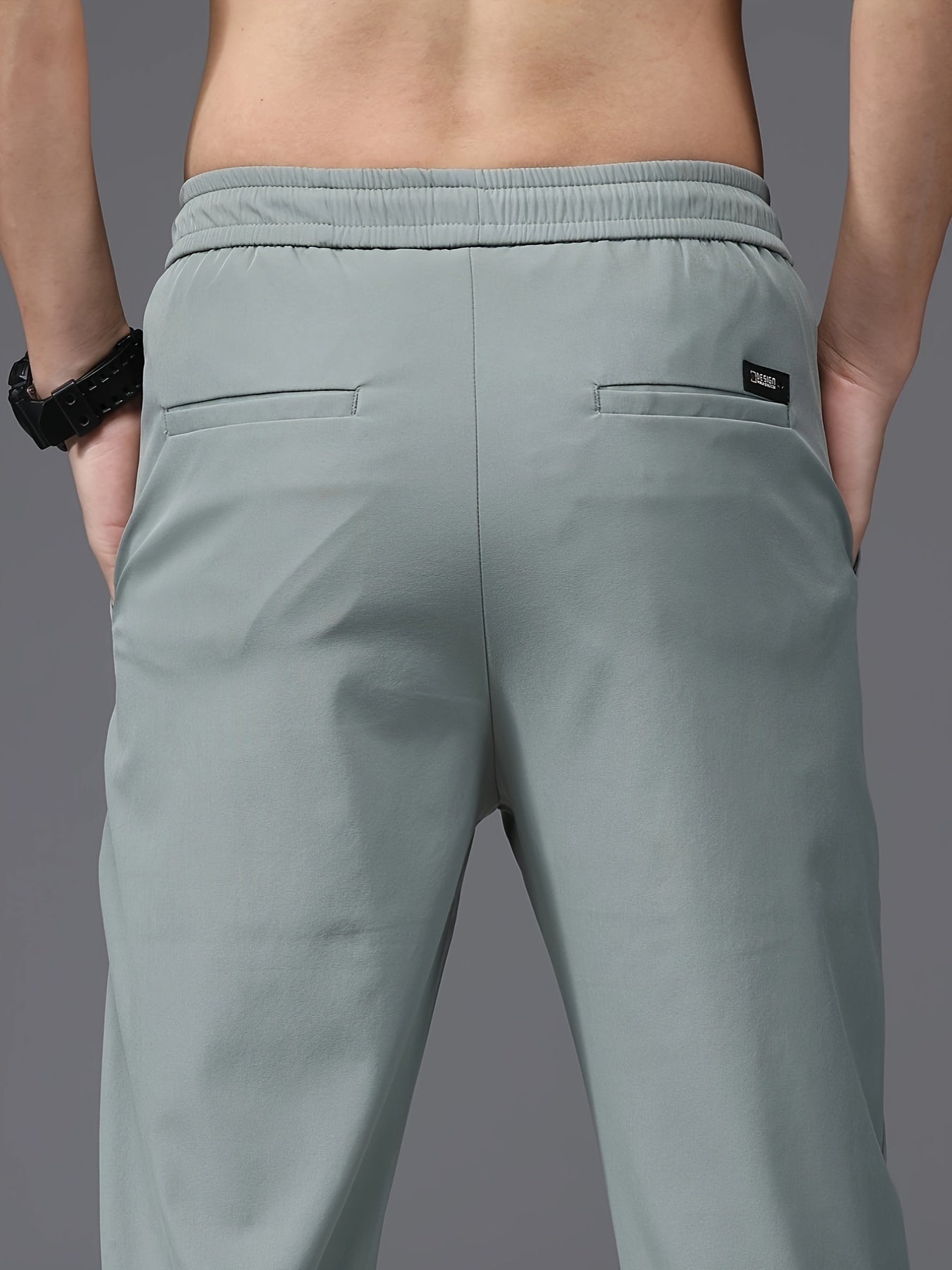 Men's slim fit drawstring sports pants, lightweight quick-dry trousers for summer leisure wear.