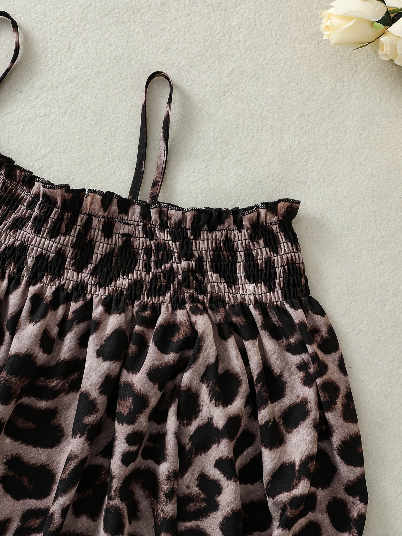 Stylish leopard print off-shoulder blouse with asymmetrical hem in non-stretch polyester blend for women.