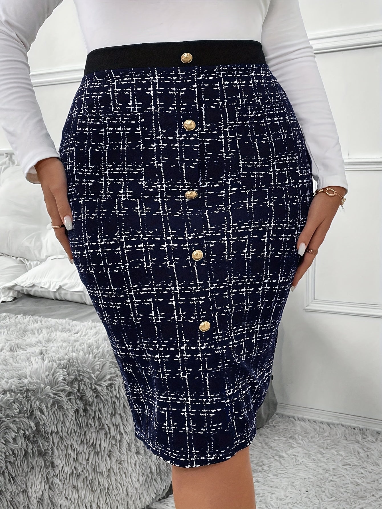 Chic plus-sized skirt in dark blue and black herringbone pattern, high-waisted, button-front, knee-length, perfect for office or casual wear