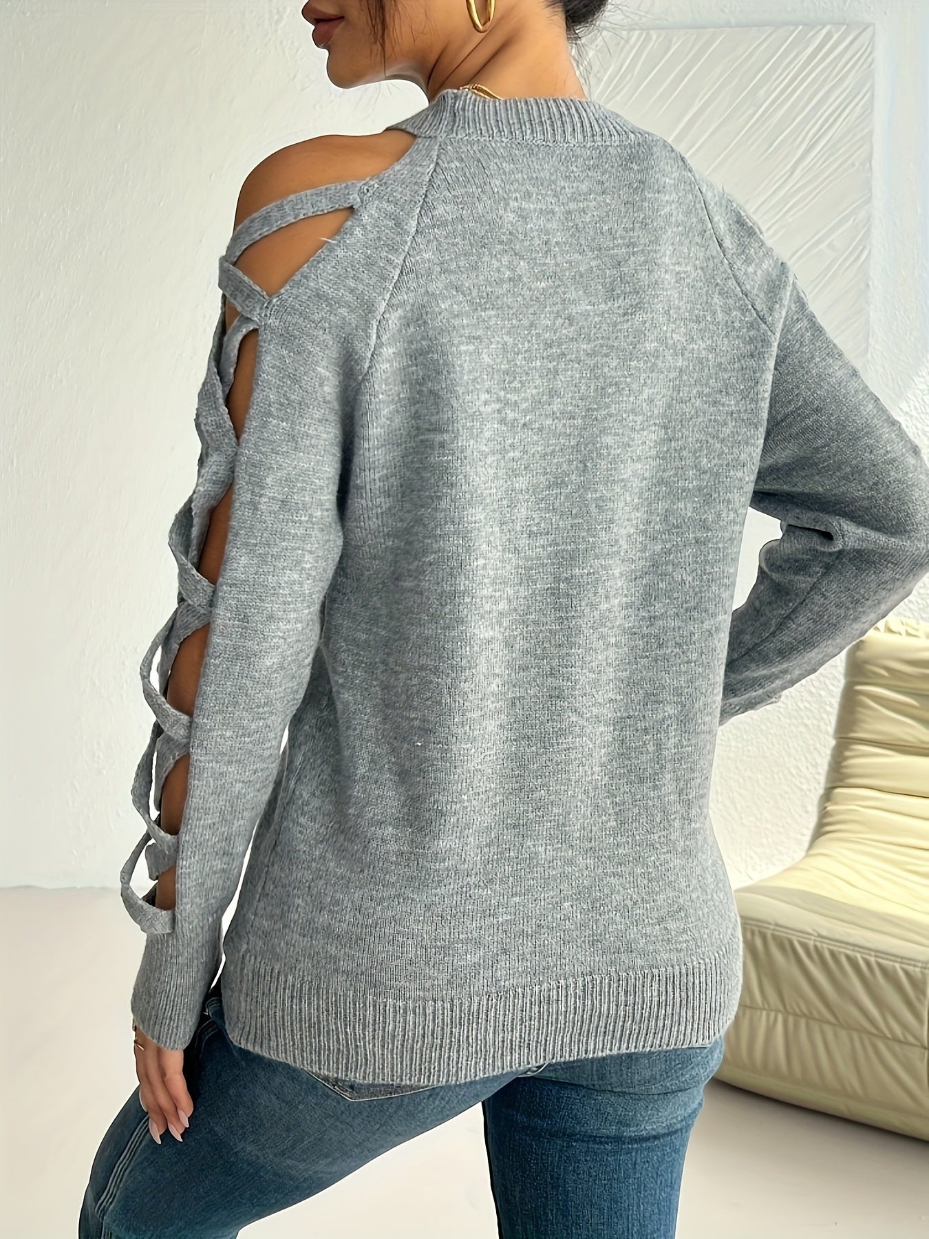 Stylish women's pullover sweater with cut-out sleeves, made of soft nylon/polyester/acrylic blend. Perfect for fall fashion, featuring textured sleeves and a round neck.