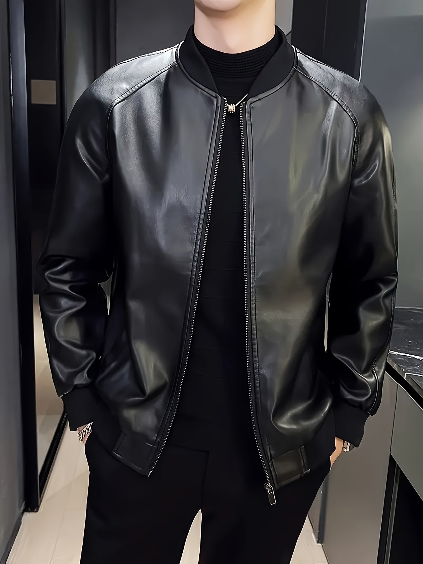 Stylish men's black PU leather jacket with casual baseball collar, zip-up pockets, loose fit, and machine washable - perfect for casual attire.