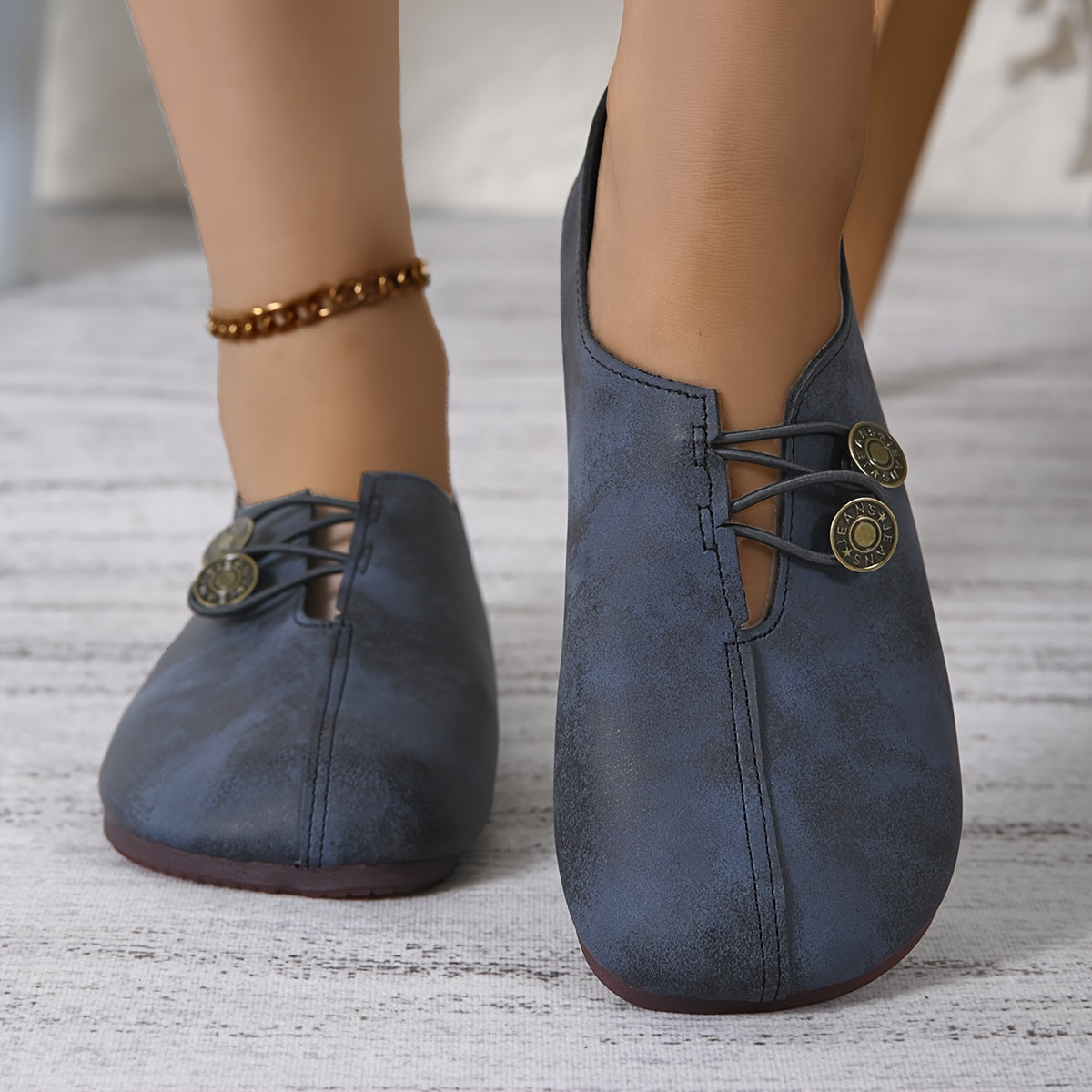 Women's casual single shoes with round toe and soft sole, featuring buckle decoration and solid color design.