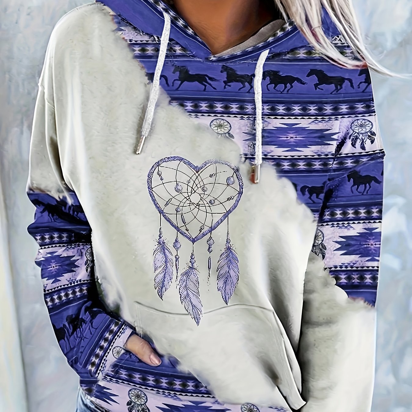 Casual hooded sweatshirt for women with ethnic print, knit fabric, and drawstring.