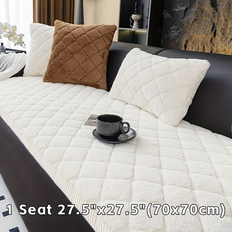 Modern quilted sofa cover, pet-friendly, machine washable, non-slip, thick polyester protector for various furniture sizes and styles in home or office décor.