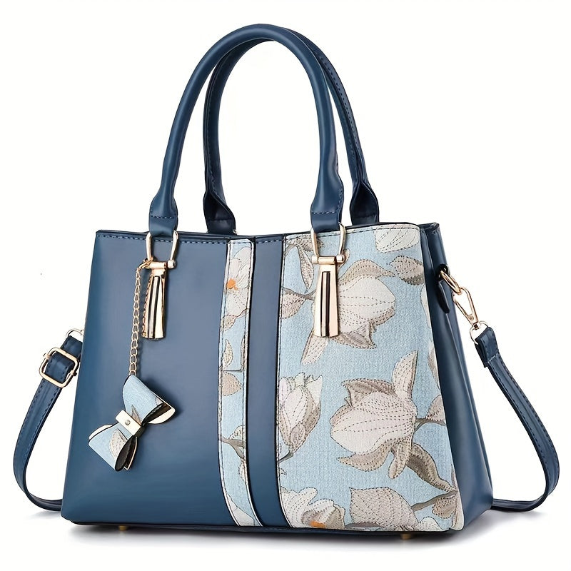 Chic floral print handbag with a spacious crossbody design.