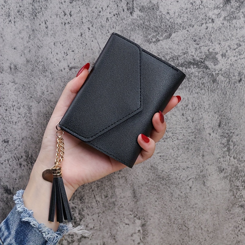 Compact trifold wallet for women with faux clutch coin purse, minimalist credit card holder, stylish tassel charm, and versatile for daily use.