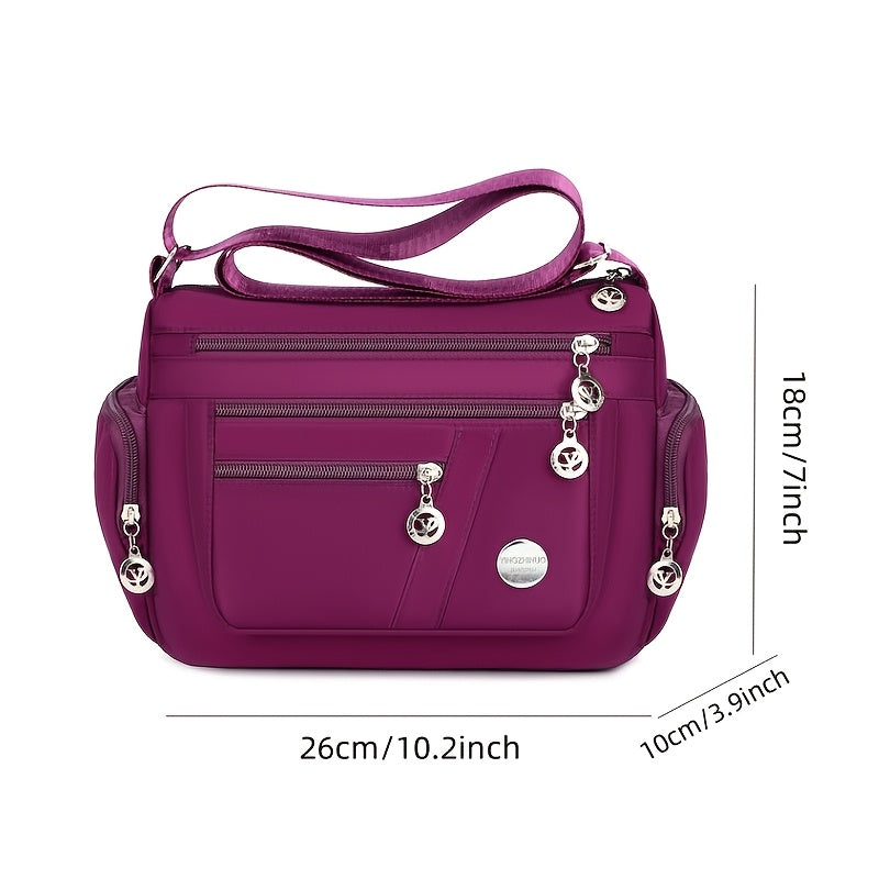 Women's versatile crossbody bag with adjustable strap, multiple compartments, zipper closure, and polyester lining for shopping, office, and travel, available in multiple colors.