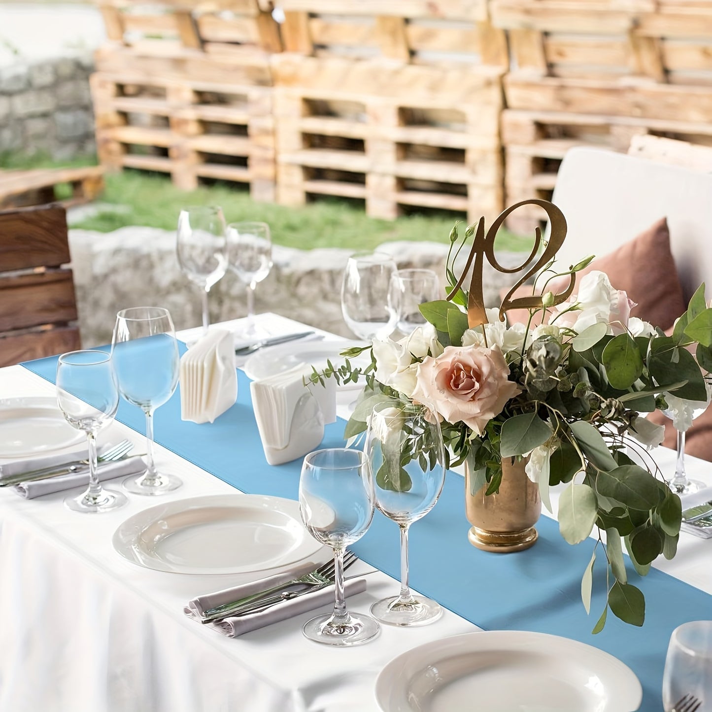 Elegant light blue satin table runner, 30.48 x 274.32 cm, ideal for weddings and formal events.