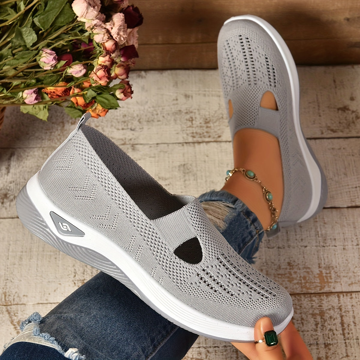 Women's slip-on sneakers in various colors with breathable fabric, EVA sole, and low-top design for all-season comfort.