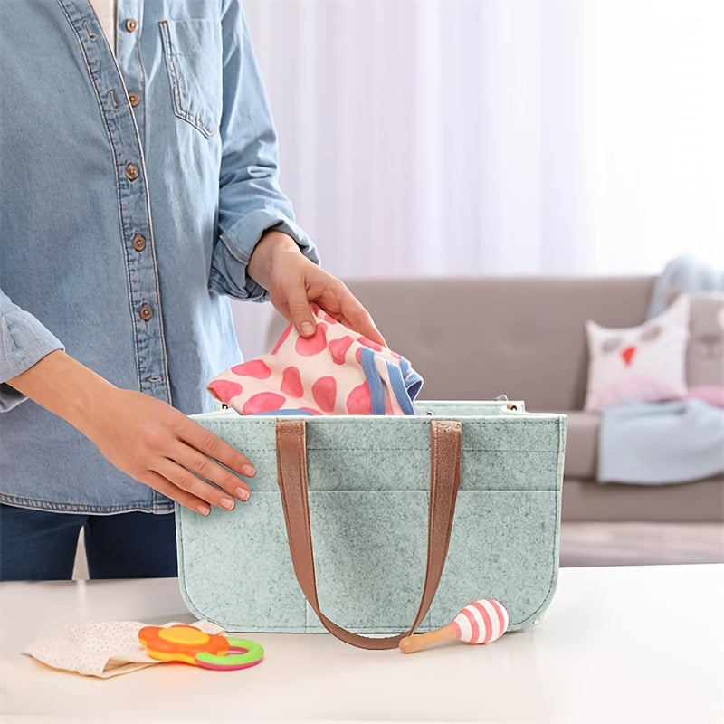 Portable and versatile Grey Patchwork Felt Diaper Caddy with convenient handles for organizing diapers. No electricity required with a sustainable wood-free design.