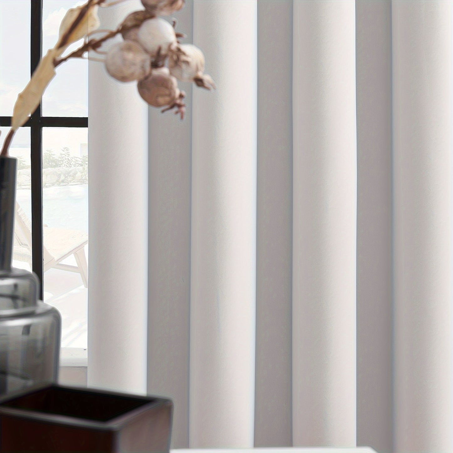 Add a touch of elegance to your living space with these 2 Panels Blackout Curtains. Perfect for both indoor and outdoor use, these curtains provide heat insulation and blackout capabilities. Made from a durable polyester blend, these simple and modern