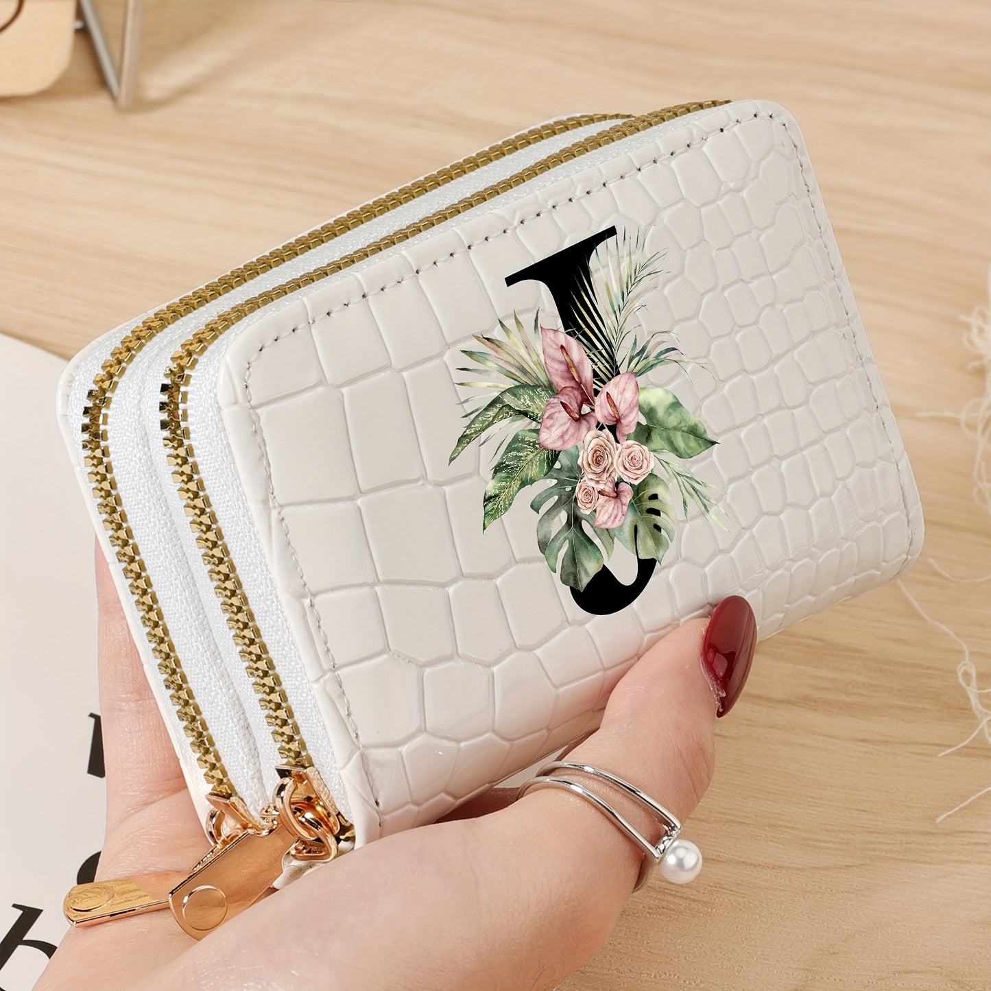 Women's credit card wallet with elegant floral letter print in black & white. Features large capacity, dual zipper, crocodile texture PU, lightweight design with nylon lining for everyday