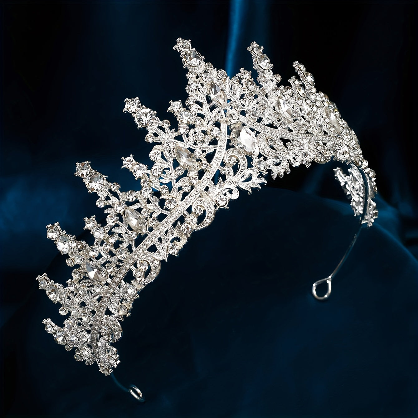 Silver alloy rhinestone tiara for elegant weddings and parties.