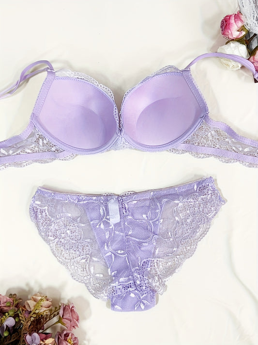 Medium support lace bra and panty set with contrast lace detail, made of 85% polyamide, 7% polyester, 5% elastane, and 3% viscose. Features drop waist briefs and chest pad.