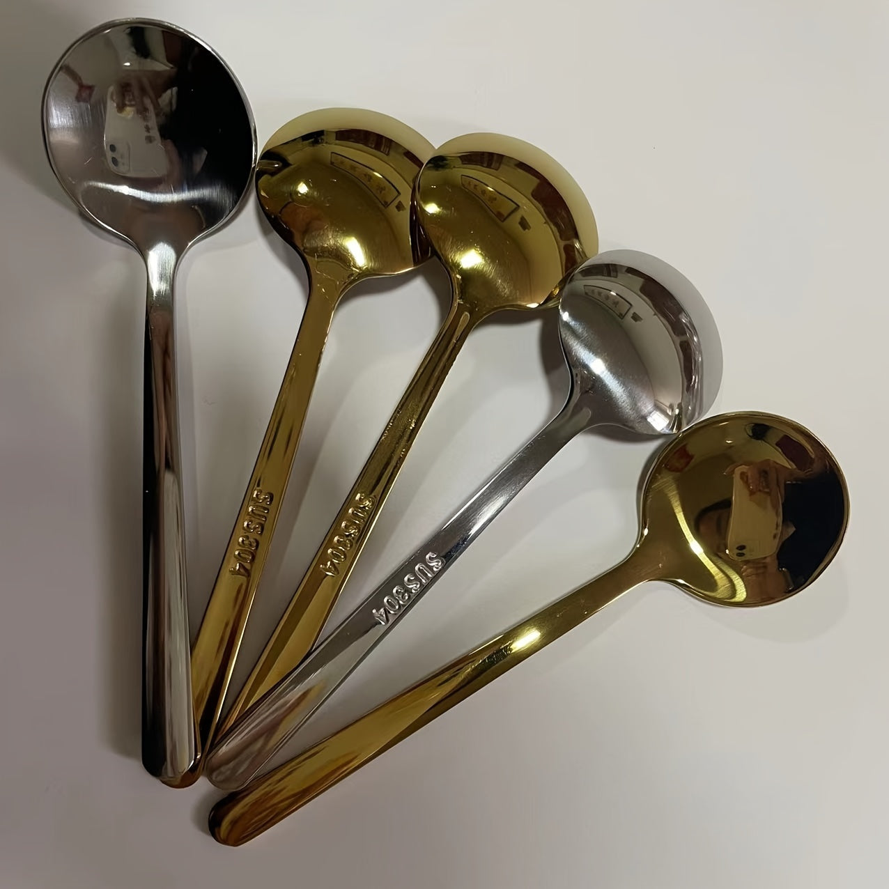 Set of five 304 stainless steel spoons, including coffee and seasoning spoons. Each spoon measures 3.86 inches in length and is perfect for gifting. These mini stirring spoons can be used for espresso, milkshakes, cappuccinos, and more. They are mirror