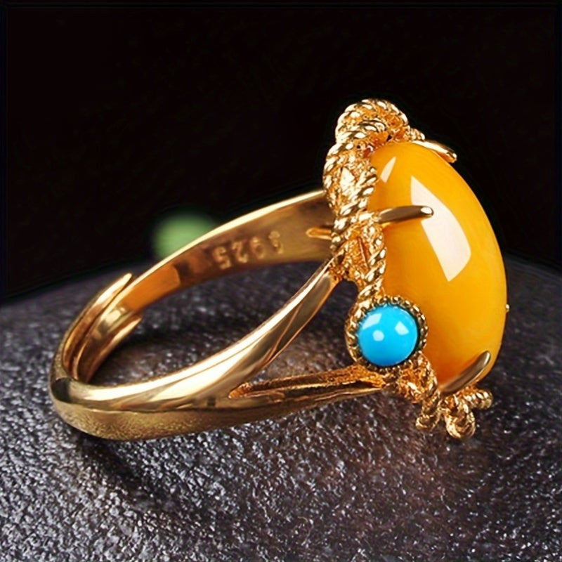 Vintage vacation style Claddagh ring featuring synthetic amber and turquoise stones, crafted with 18K golden plated 925 silver. The ring has an adjustable opening and is perfect for both daily wear and special occasions. This handcrafted personalized