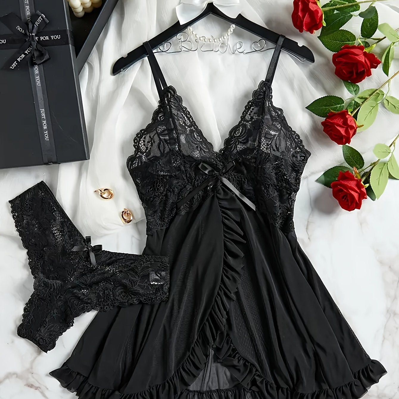 Adult sleepwear set featuring lace detail, V-neckline, backless design, ruffled hem, and knit fabric. Made of polyester. Can also be worn as an intimate doll costume.