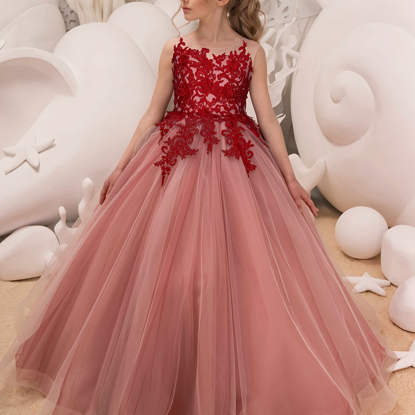 Sleeveless girls' gown with floral appliqué, perfect for performances and piano recitals.