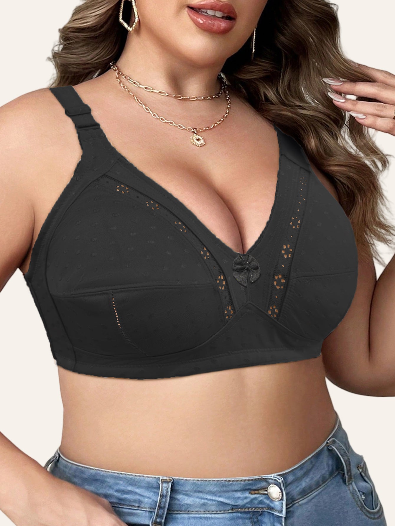 Elegant beige bra for plus size women with full coverage, wireless design, front bow detail, and floral cut-outs. Made with a soft nylon blend, wide straps, and no padding. Versatile for