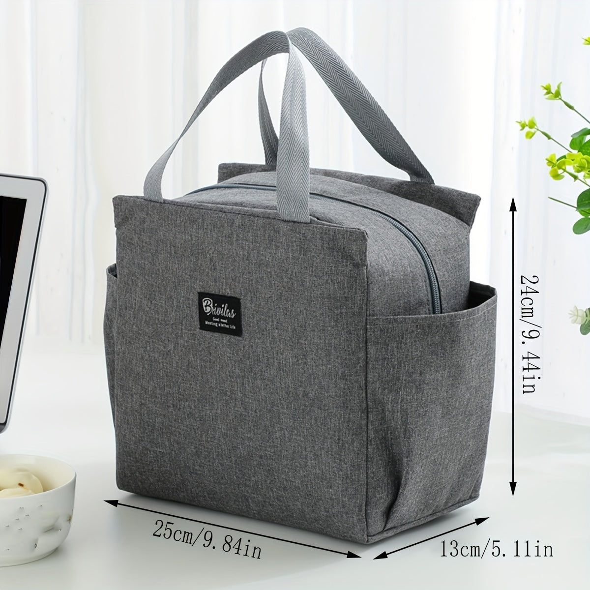 Travel in style with the Oxford Fabric Lunch Bag, a durable and insulated food container that has been thickened and expanded for extra space. This portable rectangular bento box features convenient side pockets for storing utensils or napkins. The sleek