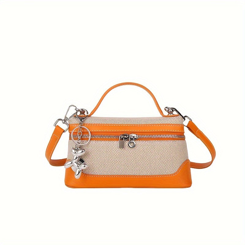 Retro-inspired mini crossbody bag for women in colorblock design, with adjustable strap and zip closure in black/blue/dark red/light brown/orange.