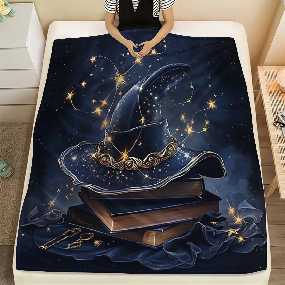 Get in the Halloween spirit with our 1 piece large book and witch hat design printed throw blanket. Made of soft flannel fleece, it is perfect for using on your sofa, bed, or while traveling or camping. This blanket is also great for adding a cozy touch