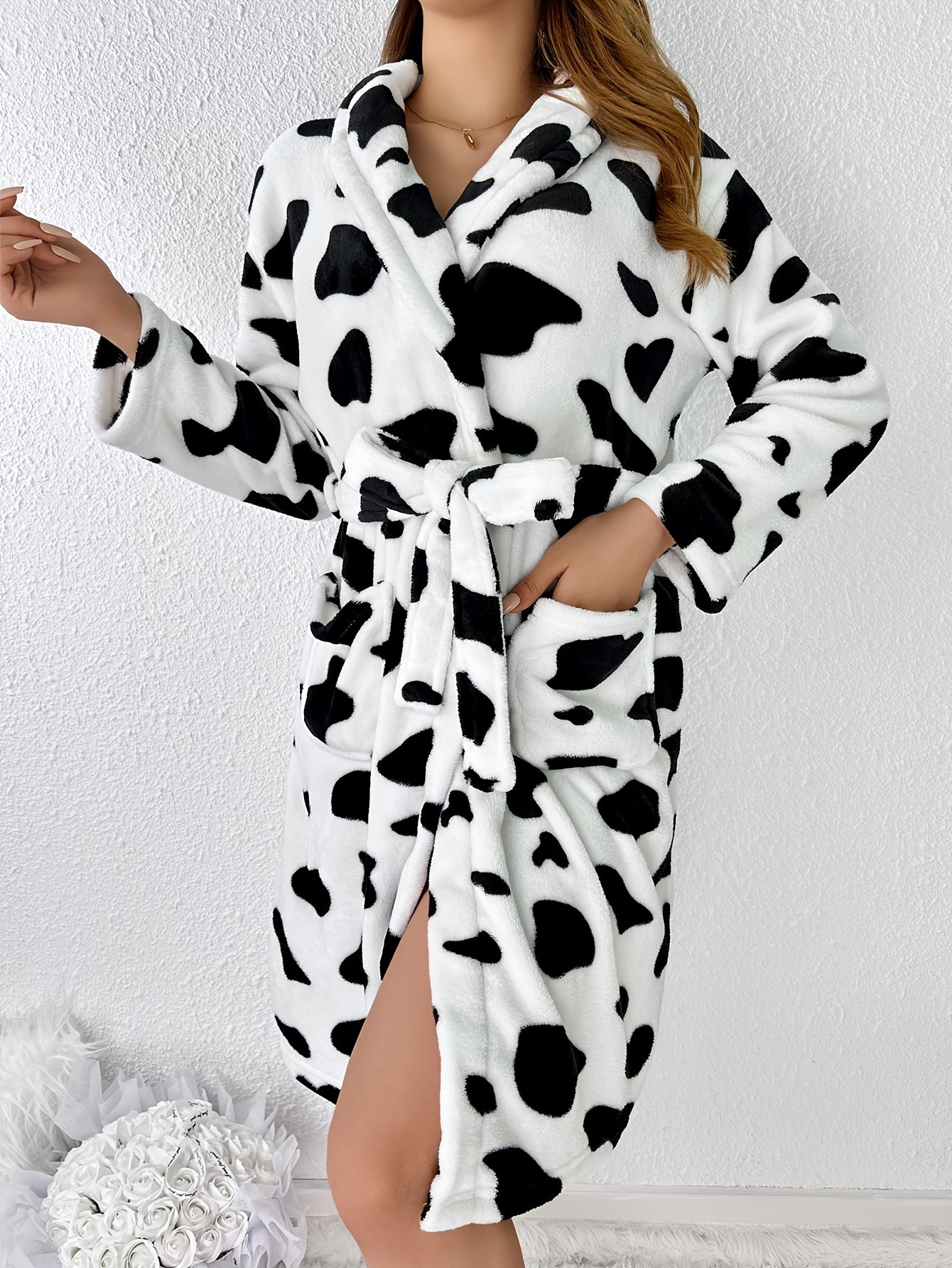 Adult cow print plush robe made of soft thickened polyester knit fabric, perfect for fall and winter home lounging.