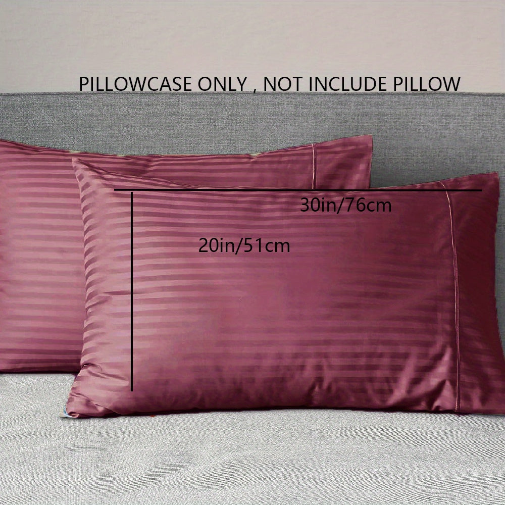 A pair of striped pillowcases made from soft, breathable woven polyester. These pillowcases are machine washable and have a sanded finish for added comfort. They do not include a pillow insert and are made from non-printed lightweight fabric with a 90gsm