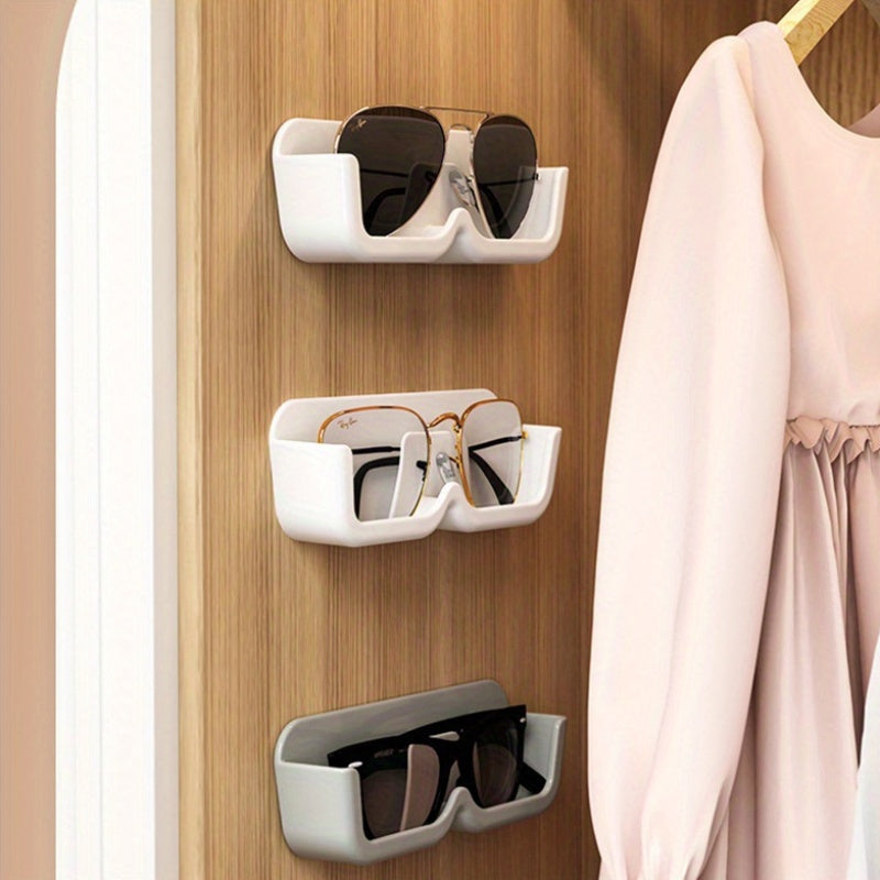 1 piece of Space-Saving Wall-Mounted Eyeglasses Holder, Stylish Display & Storage Tray without the need for drilling, made of plastic. Ideal for organizing women's fashion accessories and eyewear.