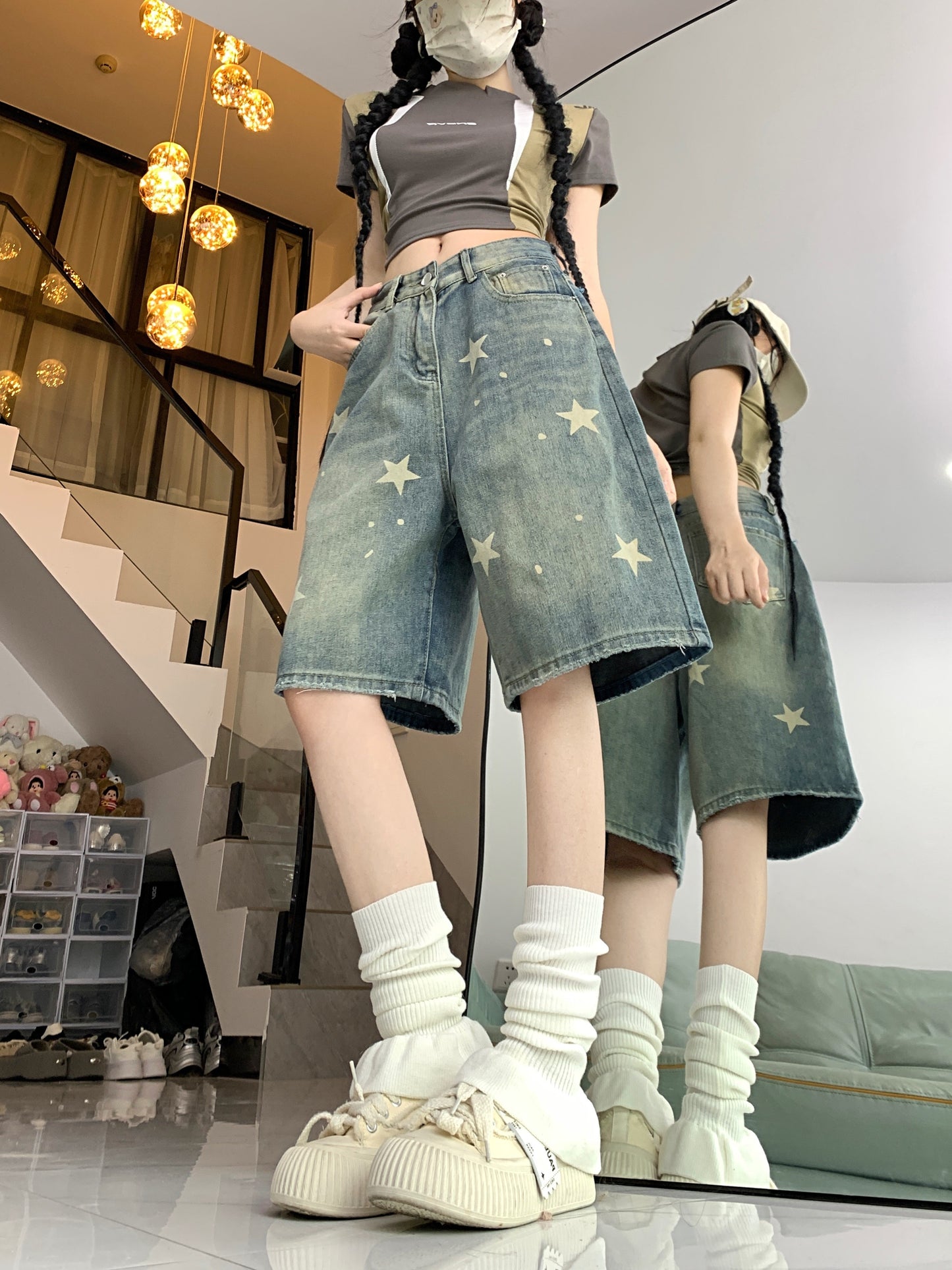 Women's casual denim shorts with star pattern, button fly, loose fit, slight stretch, and washed jeans for summer street style. Made of 70% cotton and 30% polyester.