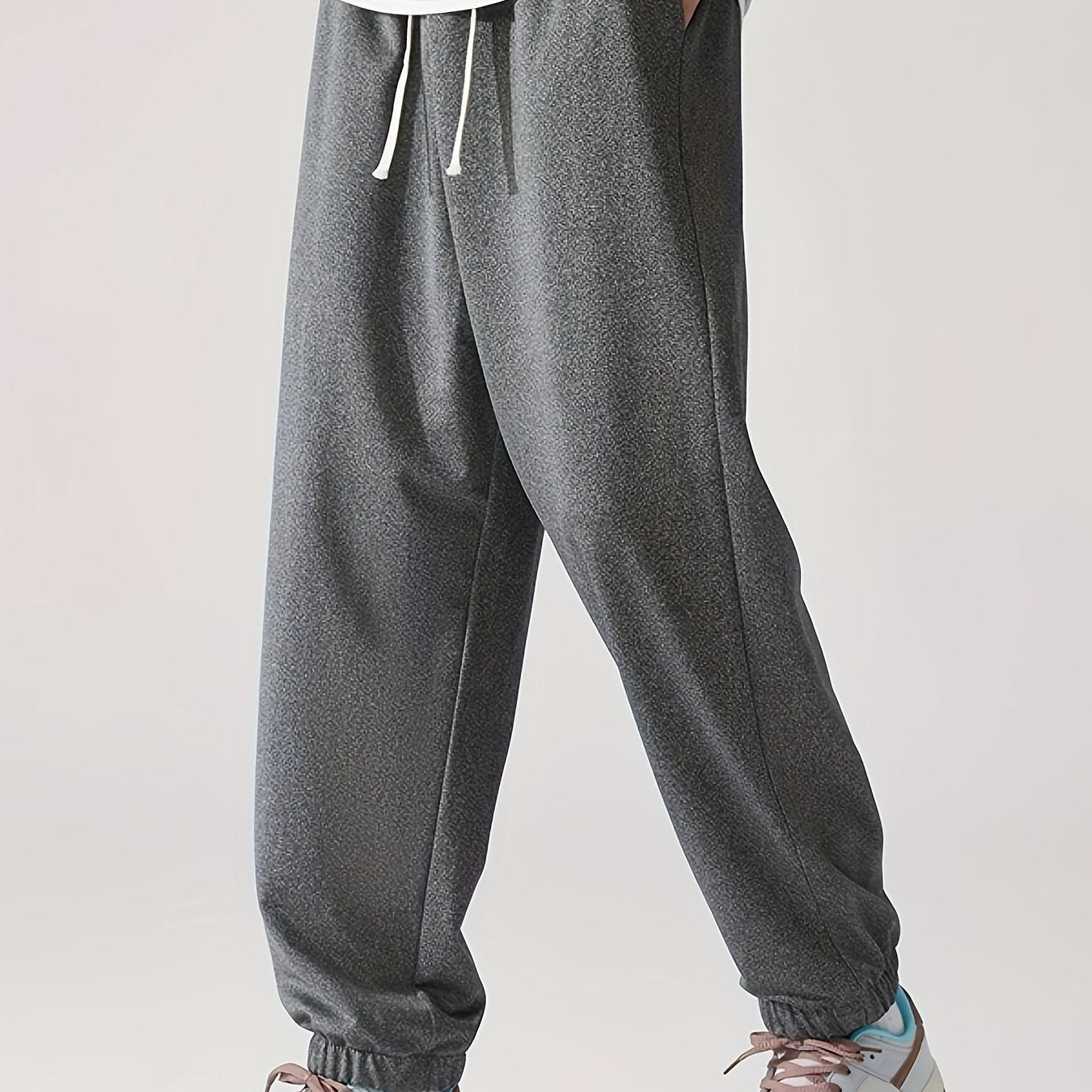 Loose fit, striped sweatpants for men, plus size, made of polyester blend with elastic waistband and drawstring. Machine washable for year-round comfort.