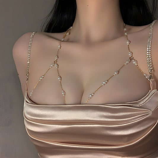 The woman personifies grace and refinement in a stunning body chain adorned with golden imitation pearls, ideal for adding a touch of glamour to any party or night out.