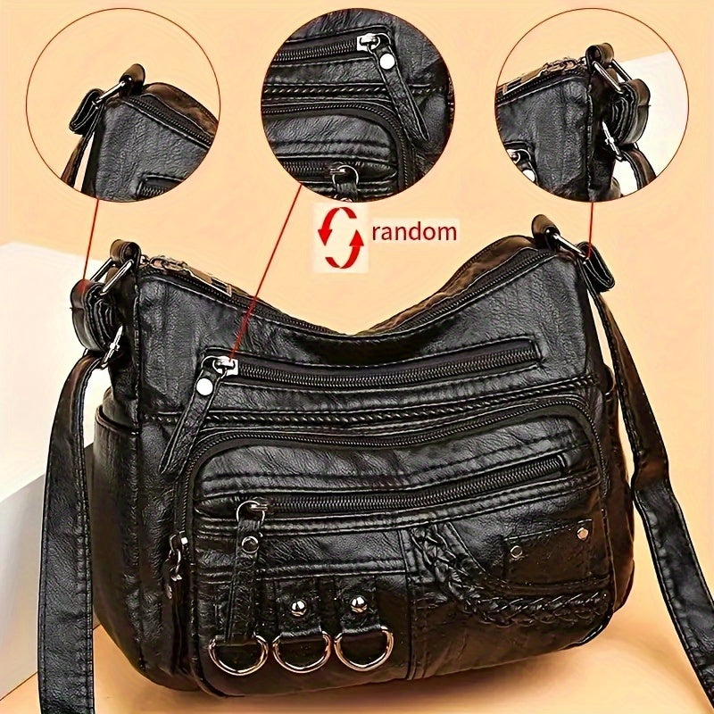 Casual black crossbody bag with multiple zippers for daily use.