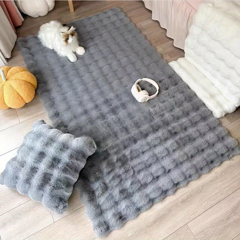 This high-pile plaid carpet in winter features a soft pink rabbit faux fur touch, making it warm and fluffy. The non-slip faux fur rug is perfect for adding a cozy touch to your living room. Measuring 60 x 120 cm, it is the ideal size for any space.