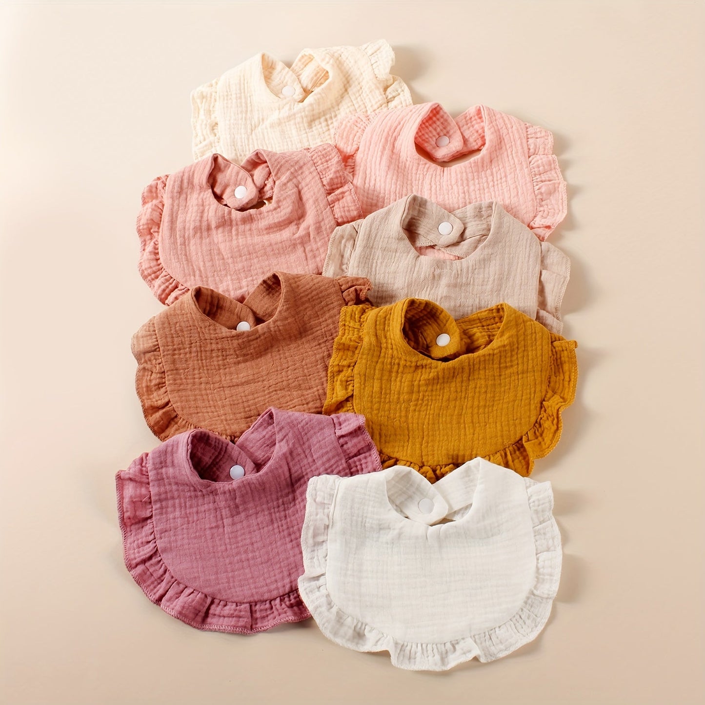 Eight pieces of 2-layer soft bibs with wrinkle-resistant and breathable fabric, ideal for feeding and keeping baby clean. These adorable cotton ruffle bibs are perfect for catching saliva and spills.