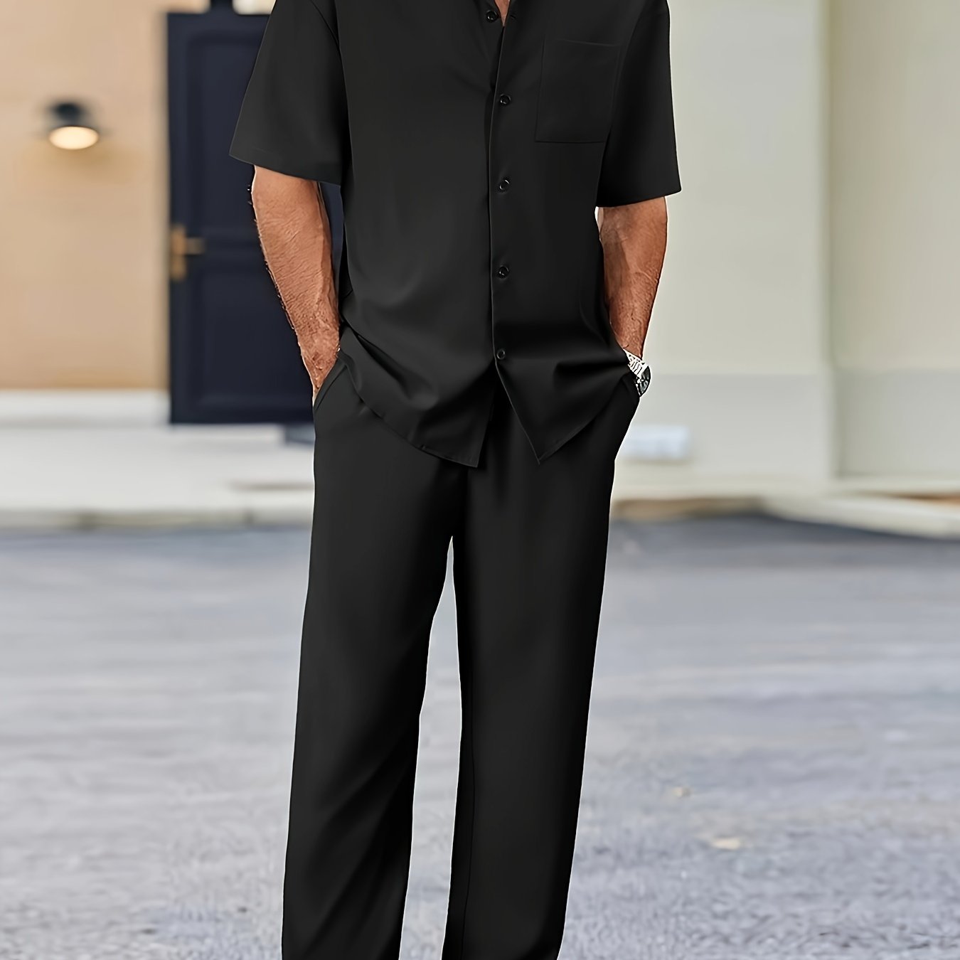 Men's casual suit-inspired set includes short sleeve shirt and loose straight pants made of polyester, machine washable.