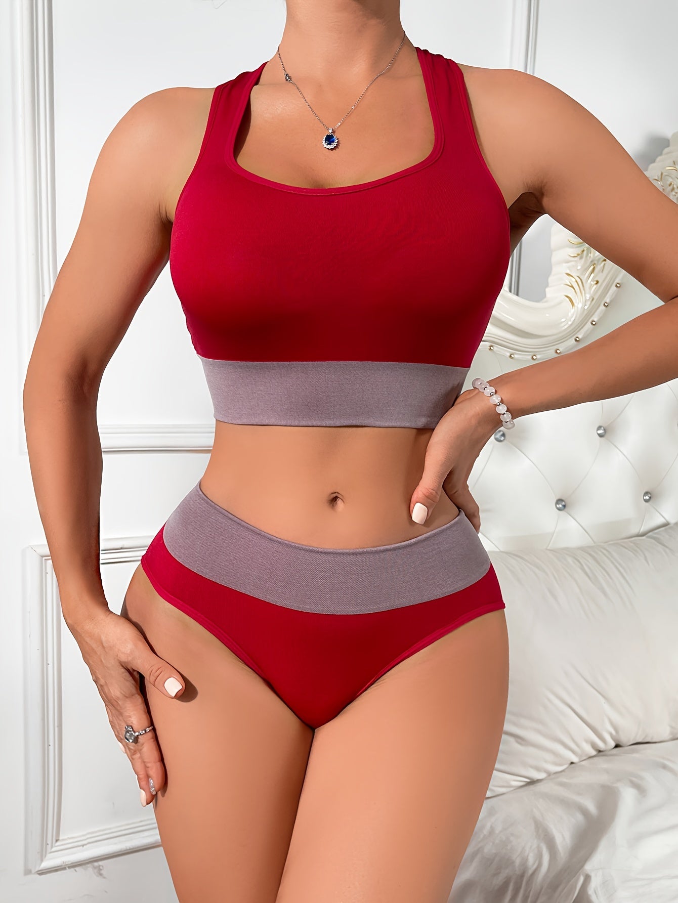 Colorblock yoga lingerie set for women - includes sexy racerback crop top and low-rise briefs with contrasting gray detail, made from breathable nylon blend.